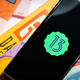 A photo of an Android device with the Android 13 logo on it